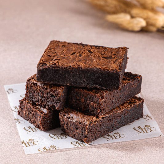 Rich fudgy American Brownie squares with glossy chocolate texture